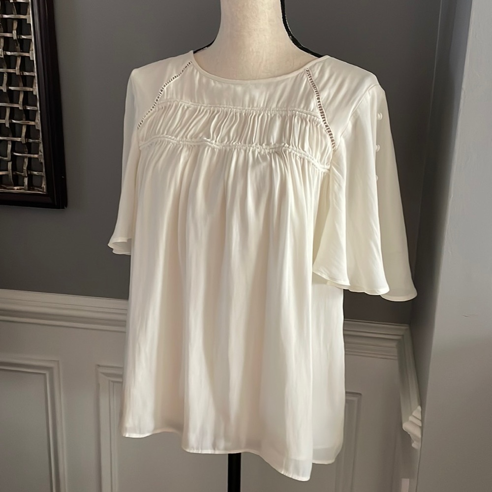 Beautiful Blouse!  Dress up or down with jeans. Great shape!